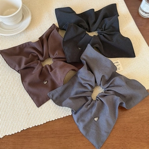 Three-piece striped scrunchie set with silver heart charms in brown, black, and grey