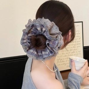 Elegant grey plaid lace hair scrunchie shown on a high bun for a sophisticated look