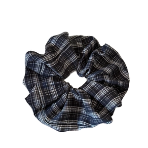 Classic black and white plaid scrunchie with vintage pleated fabric for hair styling
