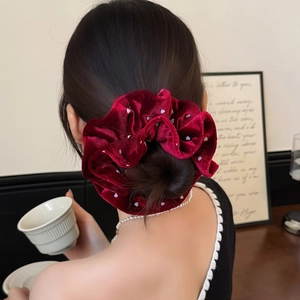 Velvet burgundy polka dot hair scrunchie styled in an elegant updo for women