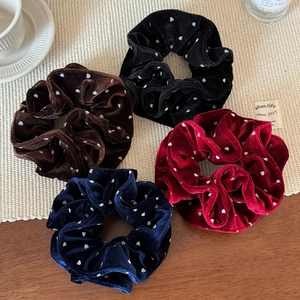 Set of four velvet polka dot scrunchies in black, brown, red and navy blue for women