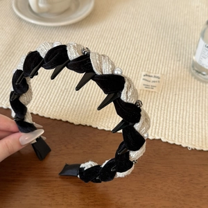 Knitted woven headband featuring black velvet, beige fabric and white pearl embellishments