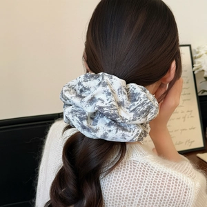 Elegant vintage ink marble print fabric scrunchie styled in a loose low ponytail