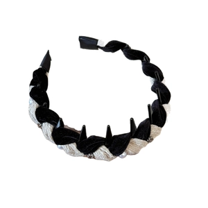 Knitted woven headband with black velvet, cream fabric, and decorative black spikes