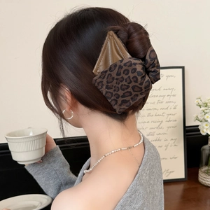 Vintage leopard print hair claw clip with brown leather bow for elegant women updo styles