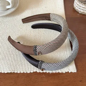 Padded houndstooth headband with square rhinestone buckle in brown and grey tones