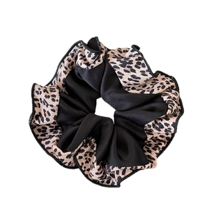 Leopard print and black fabric scrunchie with a stylish pleated oversized design