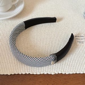 Detail of houndstooth headband with rhinestone accents and square crystal drop