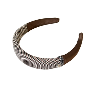 Classic houndstooth headband with sparkling rhinestones and brown leather accents