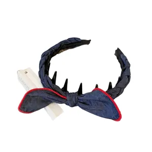 Polka dot denim knot headband with bunny ears and red stitched edges for women