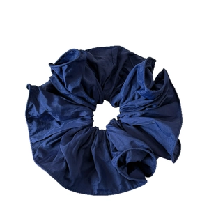 Elegant navy blue pleated satin oversized scrunchie with refined ruffled edge finish