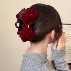 Elegant deep red velvet double bow hair claw clip with golden metal emblem for women