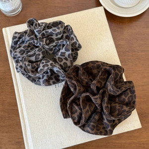 Vintage leopard print scrunchies in brown and grey fabric for stylish hair buns