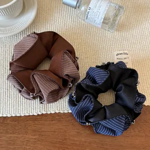 Striped rhinestone hair scrunchies in navy and brown with silver beaded edges