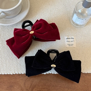Elegant velvet bow hair claws in burgundy and black with gold metal centerpiece decor