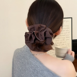 Brown pinstripe oversized scrunchie for women shown in a stylish bun hairstyle
