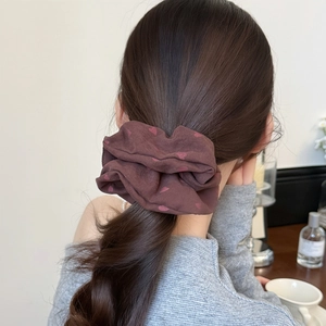 French style scrunchie with heart pattern shown on ponytail in a cozy indoor setting