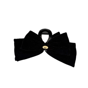 Elegant black velvet bow hair claw clip with golden wings metal detail for women