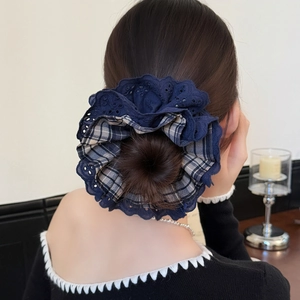 Navy lace and plaid oversized hair scrunchie shown on a woman's hair bun