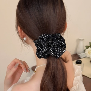 French style black and white polka dot scrunchie with a cloud-like ruffled fabric design