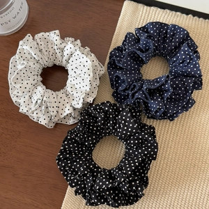 Three-pack of French-style polka dot hair scrunchies in white, navy, and black fabric