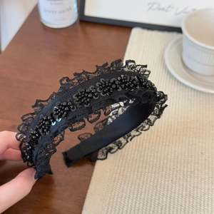 Elegant black lace headband with sequin embellishments for high cranial top hairstyle