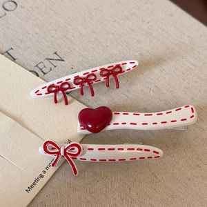 Three-piece Korean style red bow hair clips with polka dots on elegant beige fabric