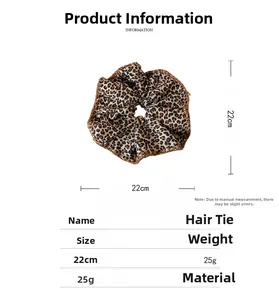 Detail view of a 22cm large leopard print fabric scrunchie showing size dimensions