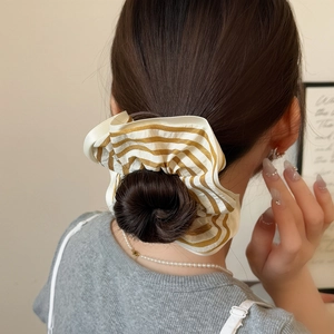Minimalist striped fabric scrunchie in cream and ginger for elegant summer hairstyles