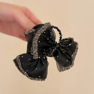 Elegant black mesh bow hair claw clip with silver rhinestones and central bead detail