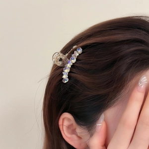 Mini transparent hair claw clip with colorful aurora rhinestones worn on hair