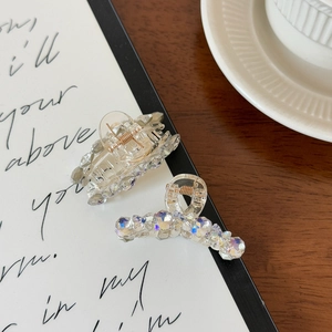 Elegant transparent acrylic hair claw clips with iridescent rhinestones in a lifestyle set