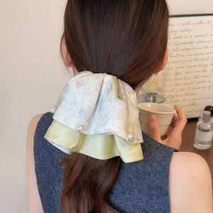 Floral tie-dye double-layer bow hair claw clip with pearl accents on back view model