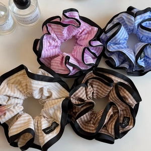 Elegant striped oversized hair scrunchies set with black trim in four pastel colors