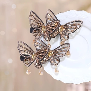 Exquisite hollow butterfly hair clips with amber rhinestones and elegant tassels