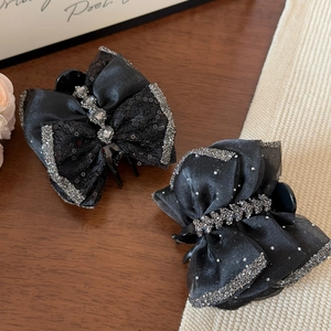 Elegante schwarze Schleifen-Haarspangen mit silbernen Pailletten und Netz-Details
