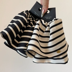 Elegant black and white striped large hair scrunchie with golden brand metal charm