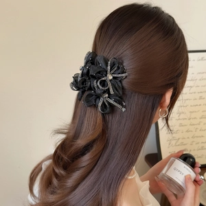 Elegant black mesh flower hair claw with rhinestones for a graceful French hairstyle