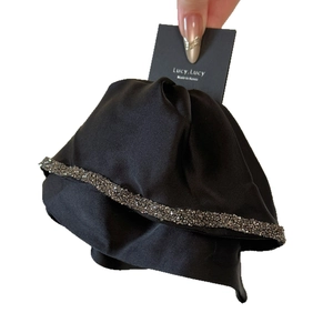 Elegant Hepburn-style black silk ribbon hair claw with sparkling diamond accents