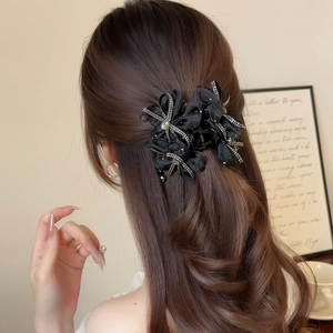 Elegant black satin flower hair claw with shimmering rhinestones for women's half-up hairstyles