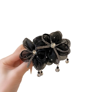 Elegant black mesh hair claw with sparkling rhinestones and beaded tassel pendants