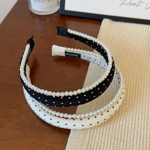 Vintage polka dot sponge headband with white pearls for women in black and white