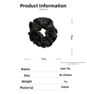Detail showing oversized black floral scrunchie with 18cm diameter and 36g weight