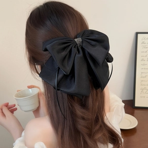 Elegant large black satin bow hair clip with sparkling rhinestones and long ribbons