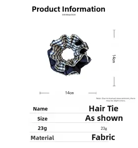 Detail view of double-layer striped scrunchie showing 14cm diameter and 23g weight