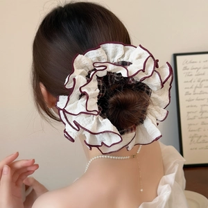 Oversized ivory scrunchie with burgundy ruffled edges for elegant ponytails
