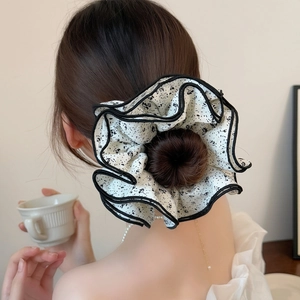 Floral chiffon scrunchie for buns in black and white pattern with scalloped edges
