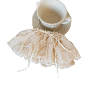 Elegant pleated lace hair clip with pearls and ribbon bow on a clean white background