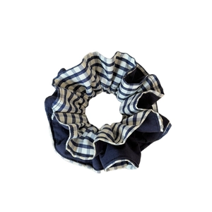 Elegant navy blue and plaid striped scrunchie for low ponytail styling on white background