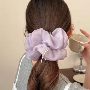 Chic lavender organza oversized scrunchie with delicate ribbon bows on a high ponytail